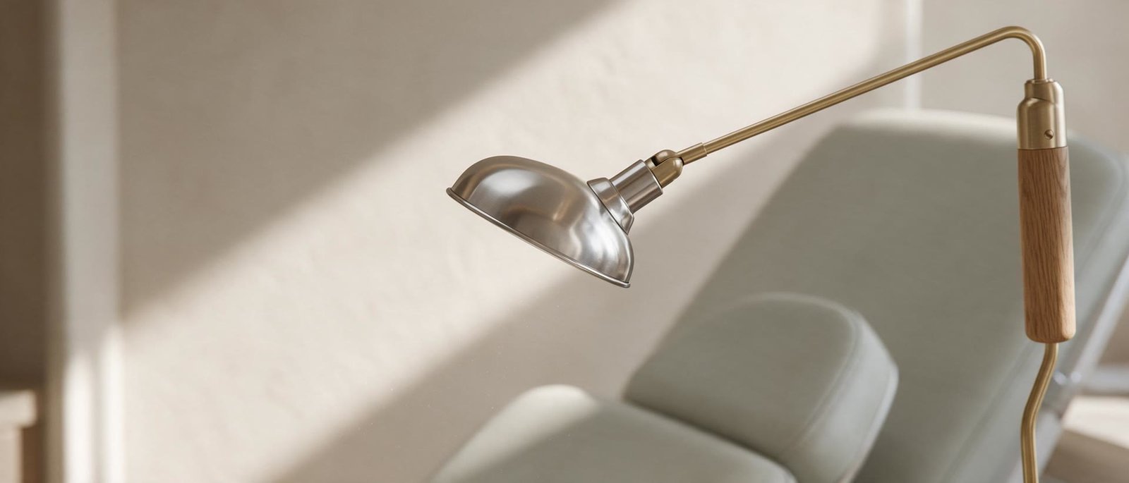 An examination lamp beside the treatment chair in morning light